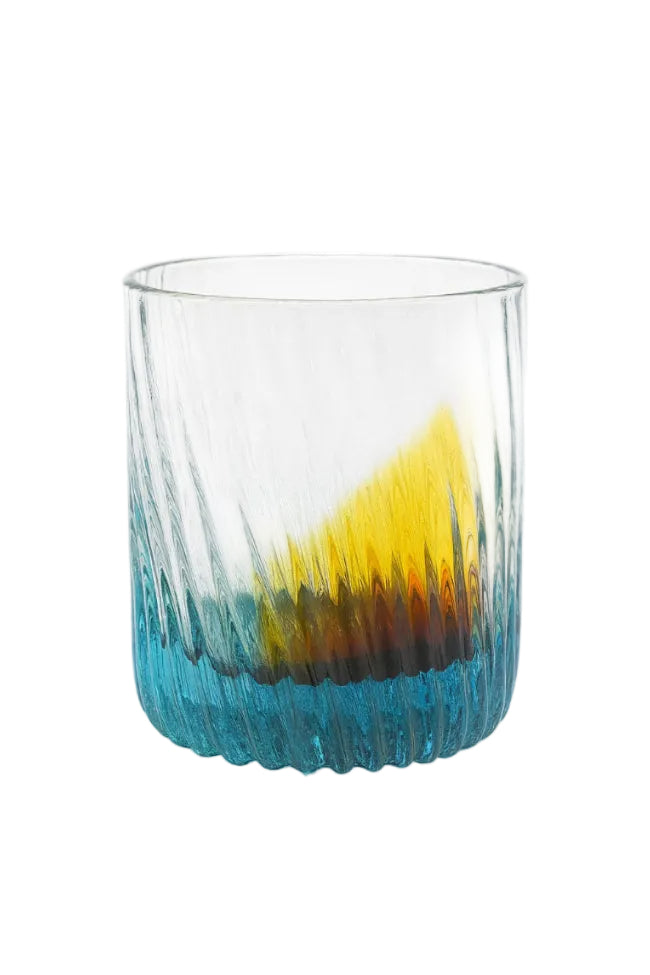 Glass with a gradient design transitioning from yellow to blue on a white background