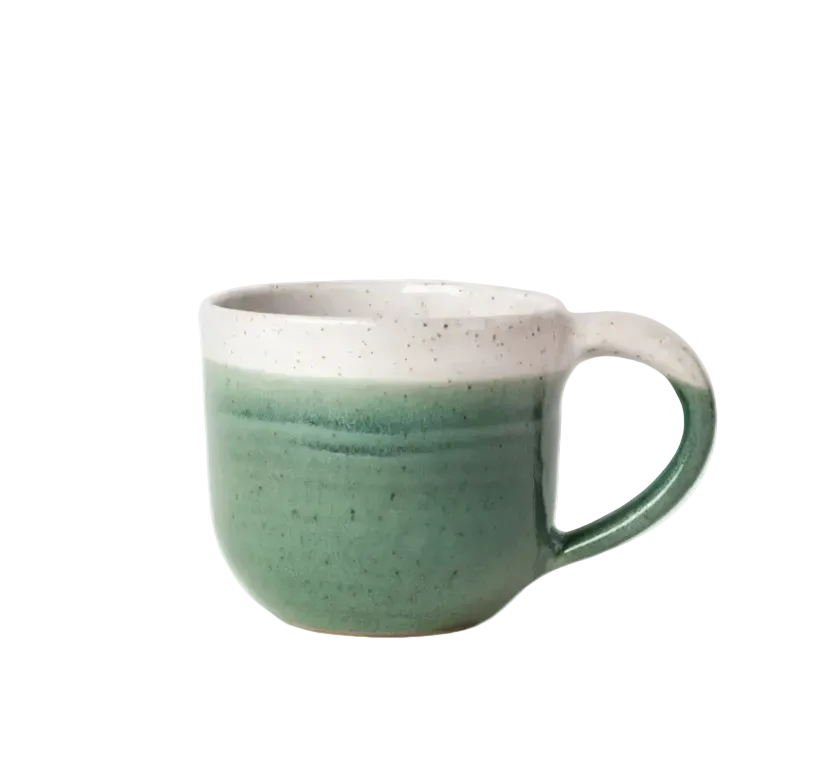 Green mug with white interior on a white background