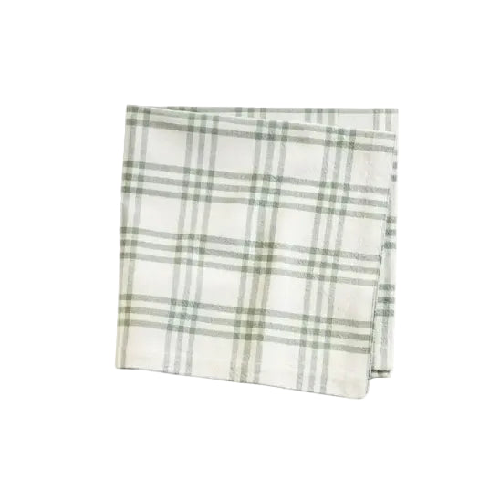 Folded plaid fabric with green and white pattern on a white background