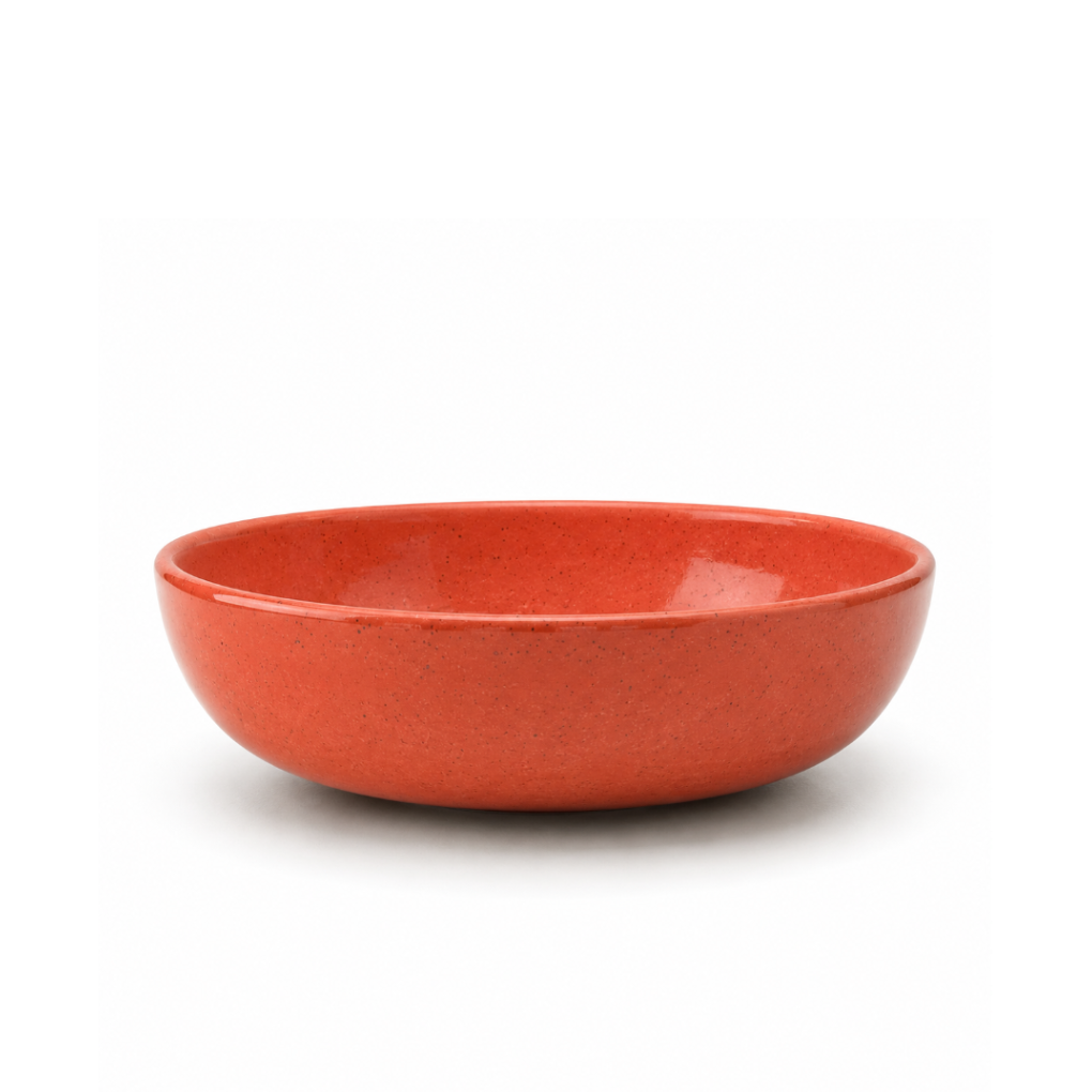 A round ceramic bowl with a textured, speckled orange-red glaze, photographed on a clean white background.