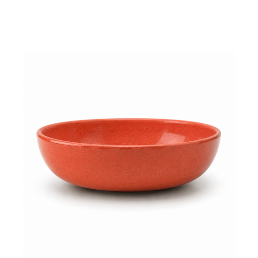 A round ceramic bowl with a textured, speckled orange-red glaze, photographed on a clean white background.
