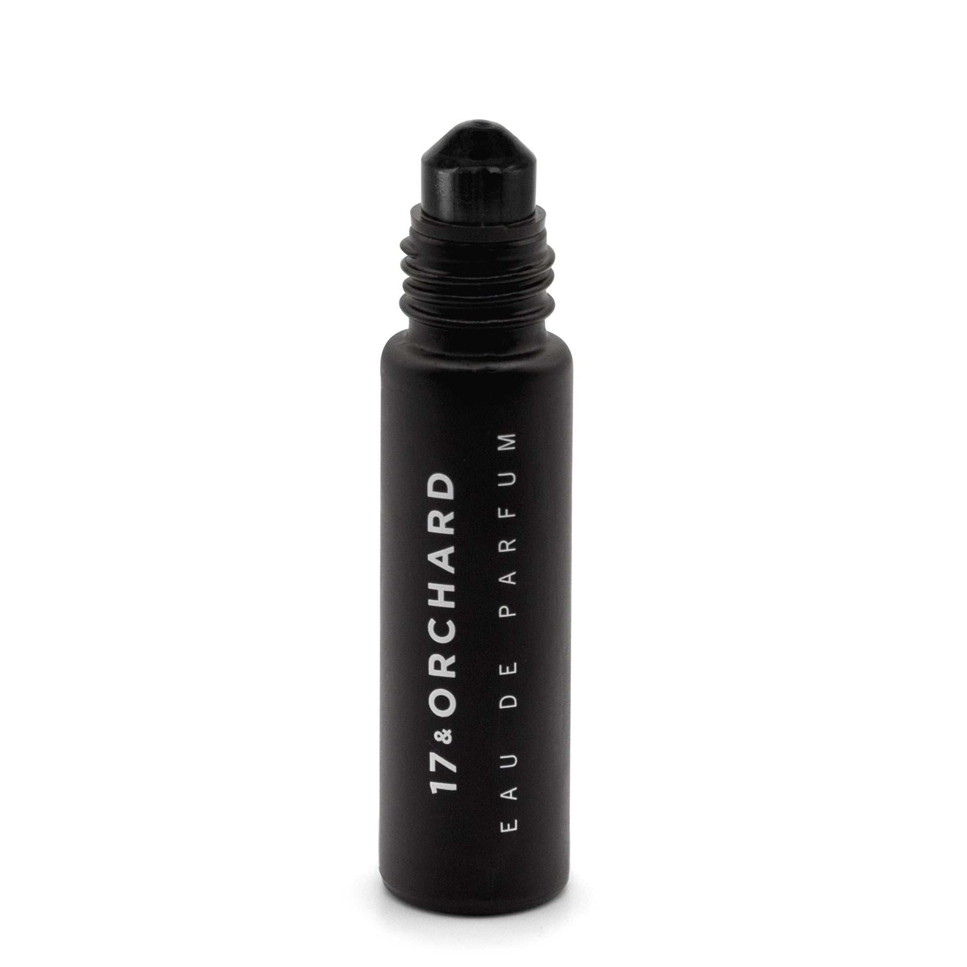 Black rollerball bottle of 17&Orchard Eau de Parfum on a white background