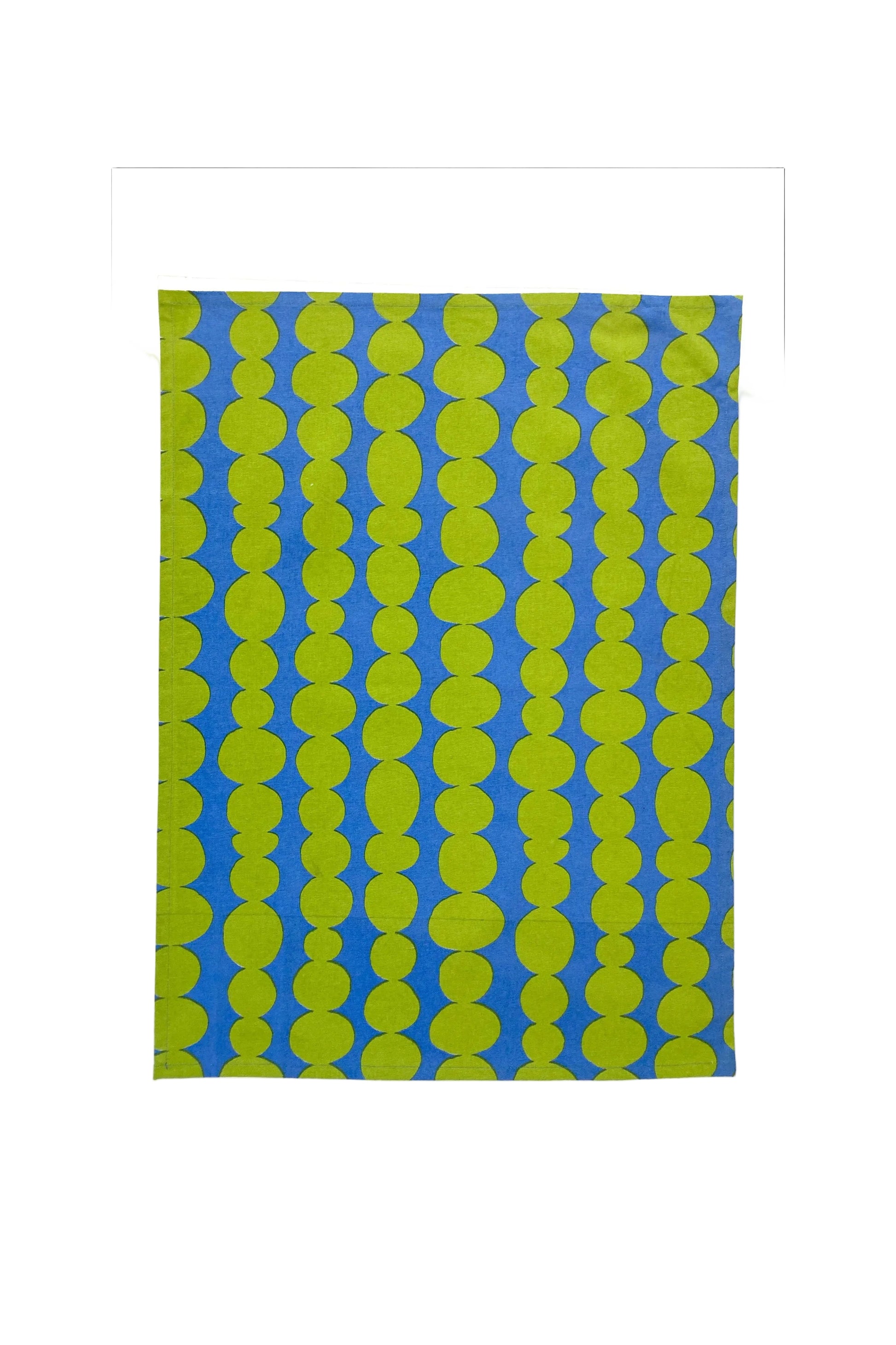 Patterned fabric with green circles on a blue background