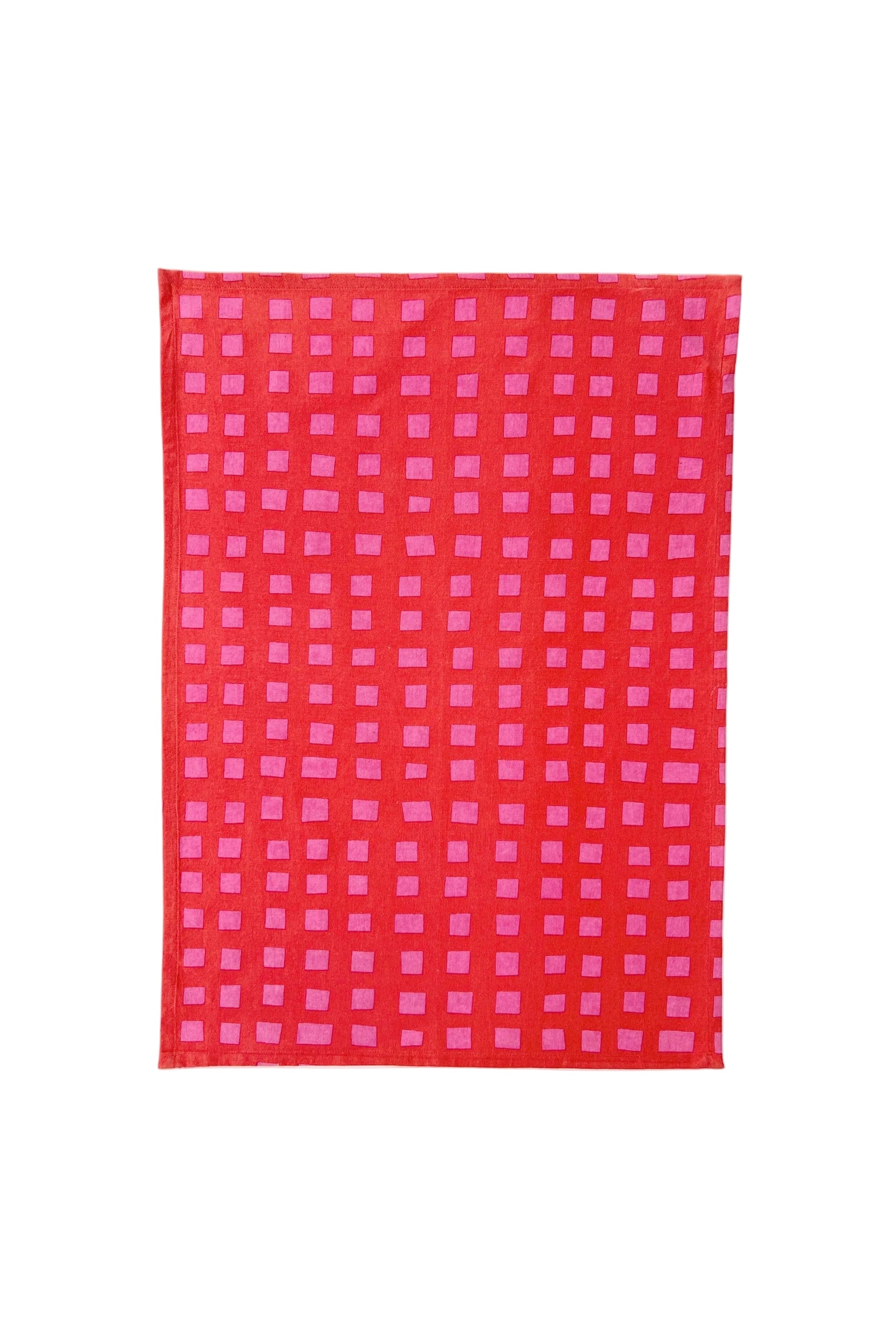 Red and pink checkered fabric on a white background