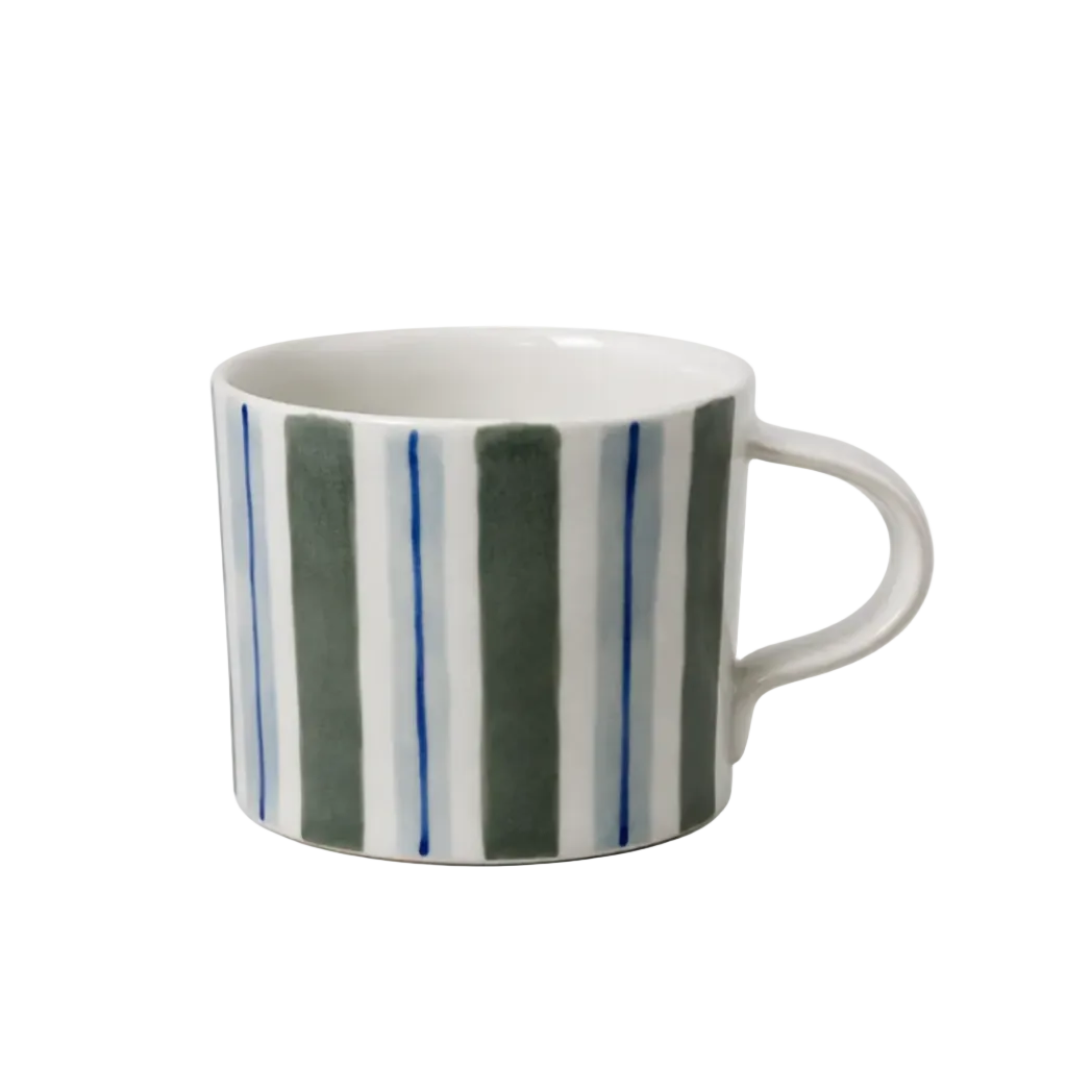 A white ceramic mug with vertical stripes in dark green, light blue, and white, featuring a curved handle on a clean white background.