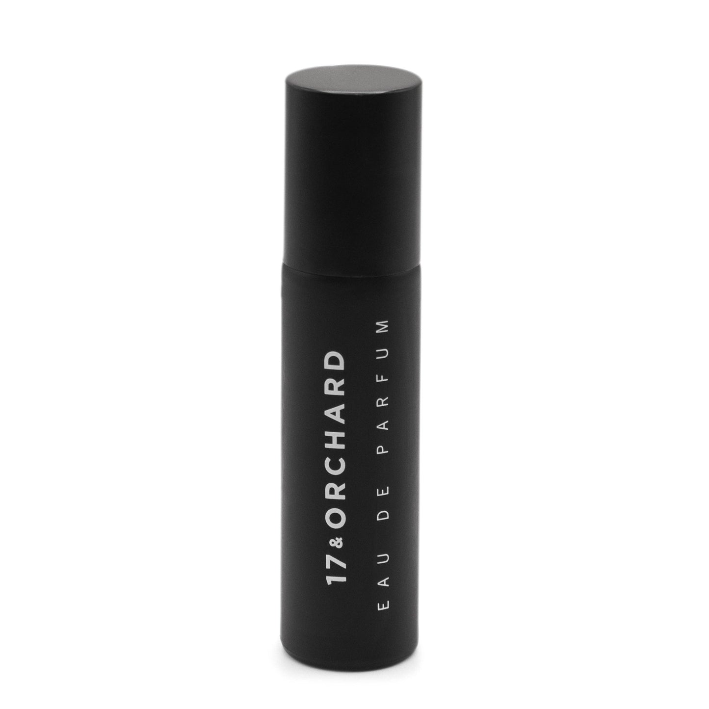 Black perfume bottle with '17&Orchard' branding on a white background