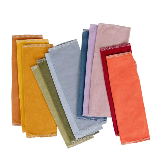 Set of colorful napkins arranged in a row on a light background