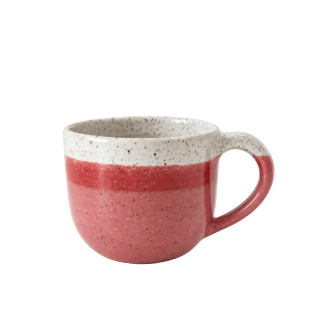 A ceramic mug with a speckled red lower body and a speckled off-white upper rim and handle, shown on a plain white background.