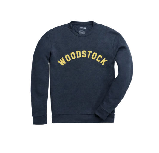 A dark navy blue crewneck sweatshirt with 'WOODSTOCK' printed in an arched yellow collegiate font across the chest, displayed on a clean white background.
