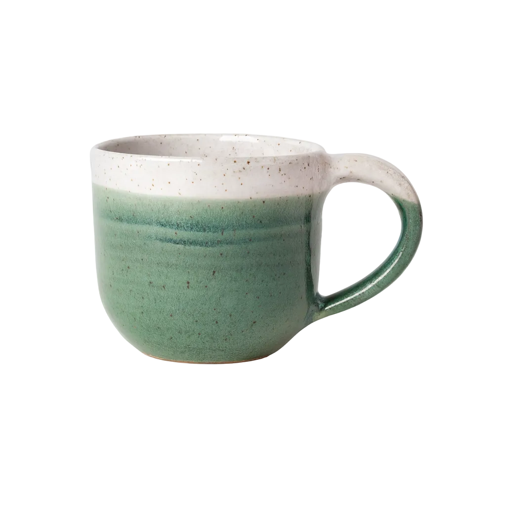 Green mug with white interior on a white background