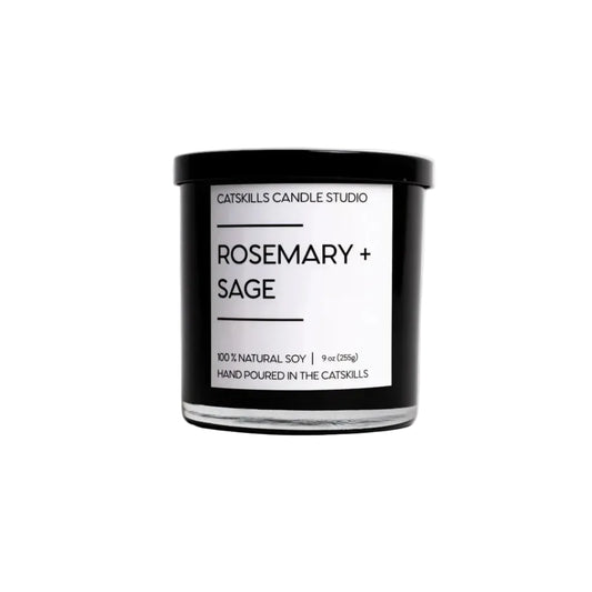 Candle with 'Rosemary + Sage' label on a white background