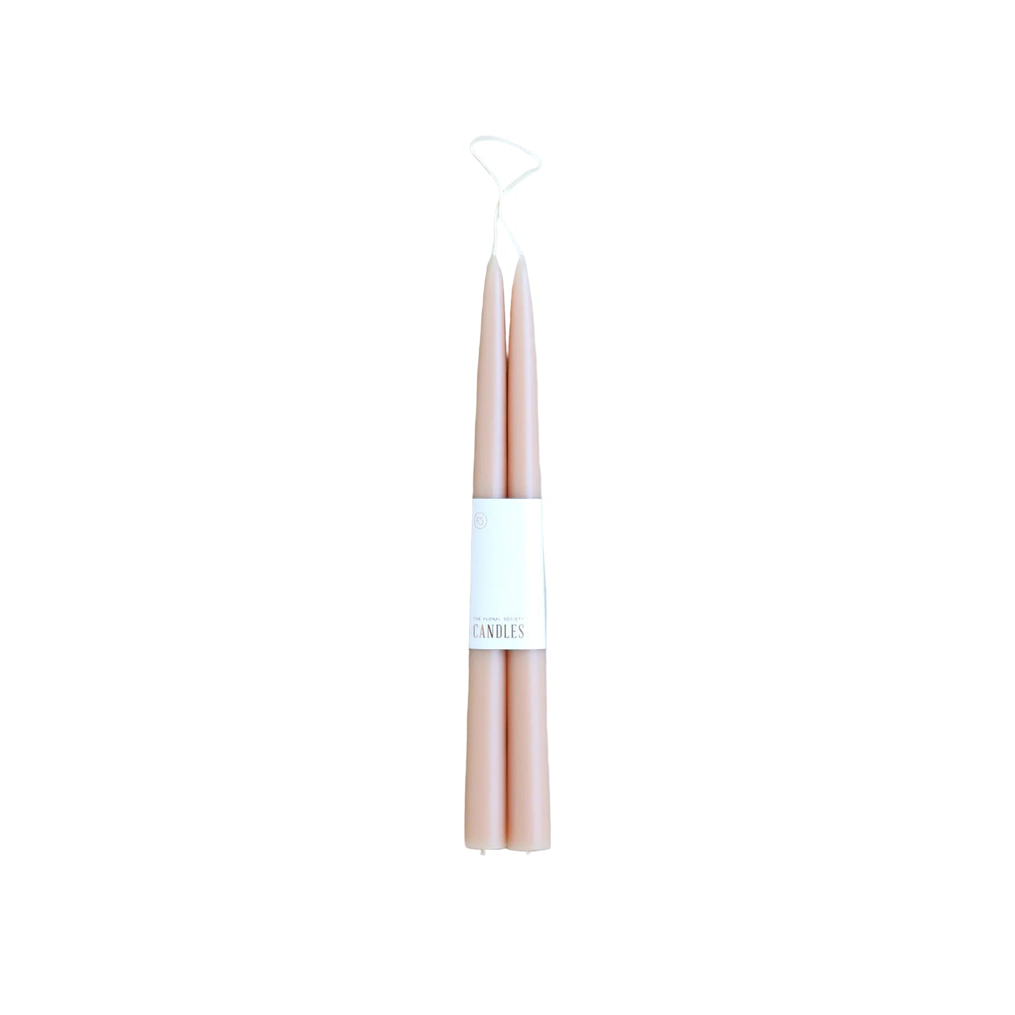 Pair of pink candles with a white label on a light gray background