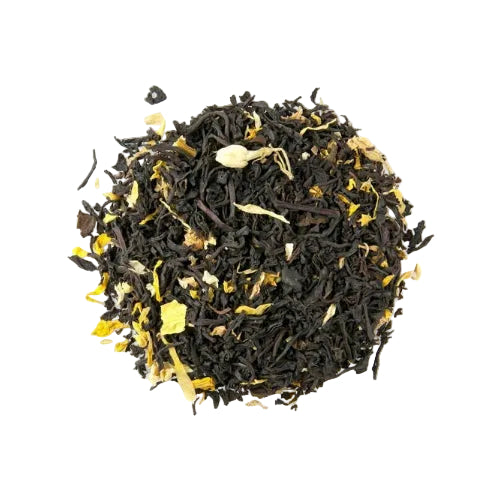 Black tea leaves with yellow flowers on a white background