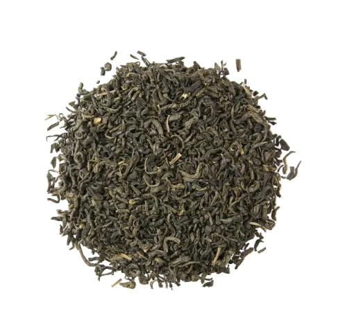 Close-up of dried black tea leaves on a white background