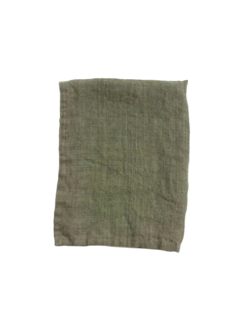 Green fabric square on a white background