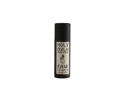 Lip balm with 'Holy Oylh' branding on a gray background