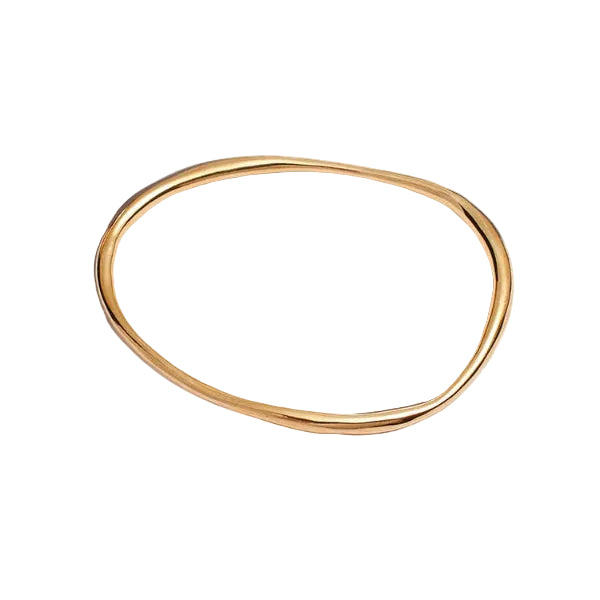 Gold bangle on a white background