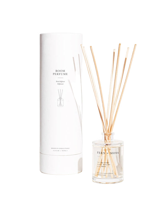 Room perfume set with diffuser and reeds on a white background