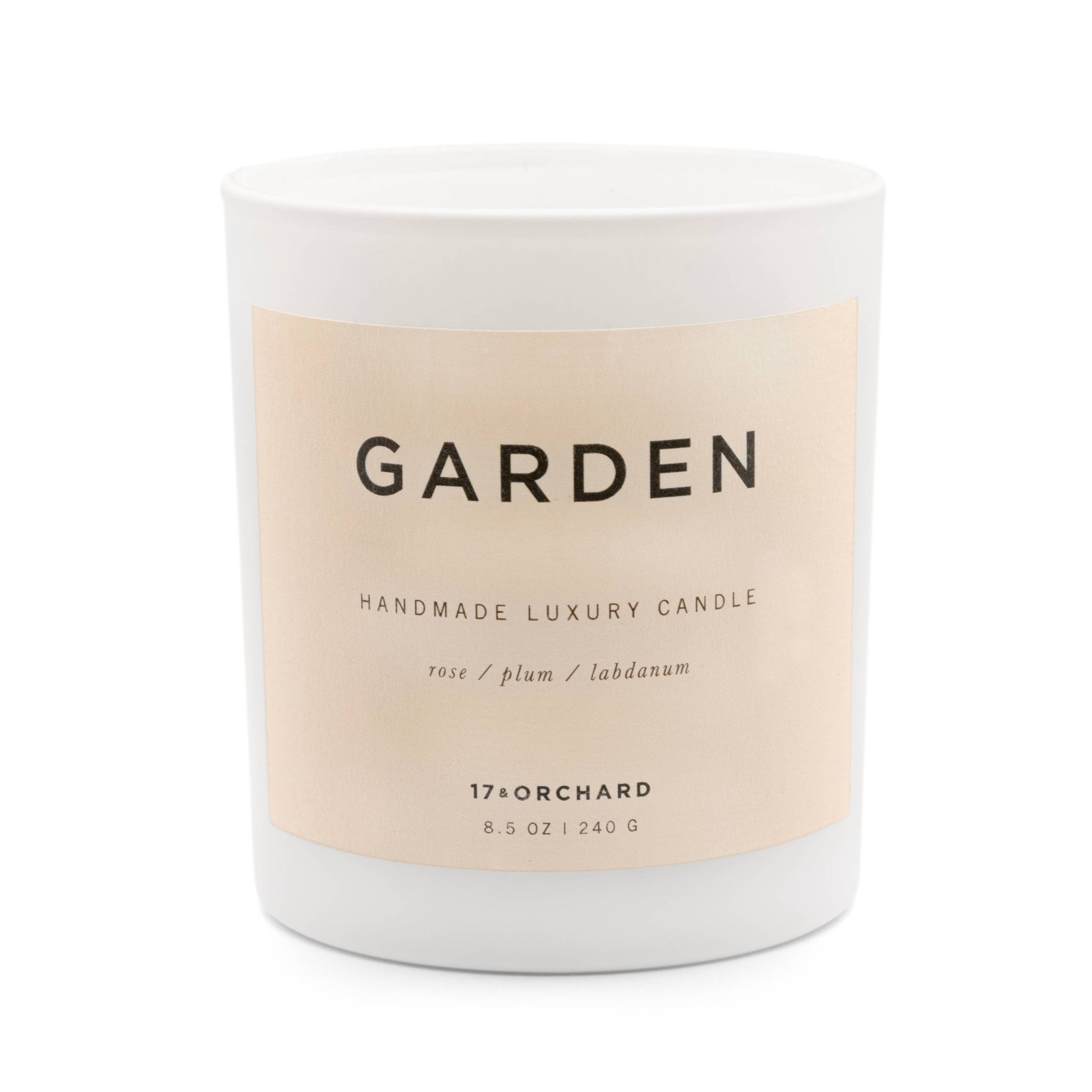 Handmade luxury candle labeled 'Garden' with a beige label on a white background