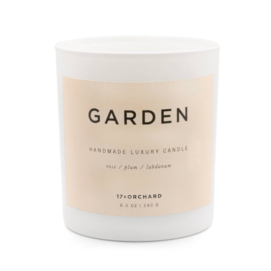Handmade luxury candle labeled 'Garden' with a beige label on a white background