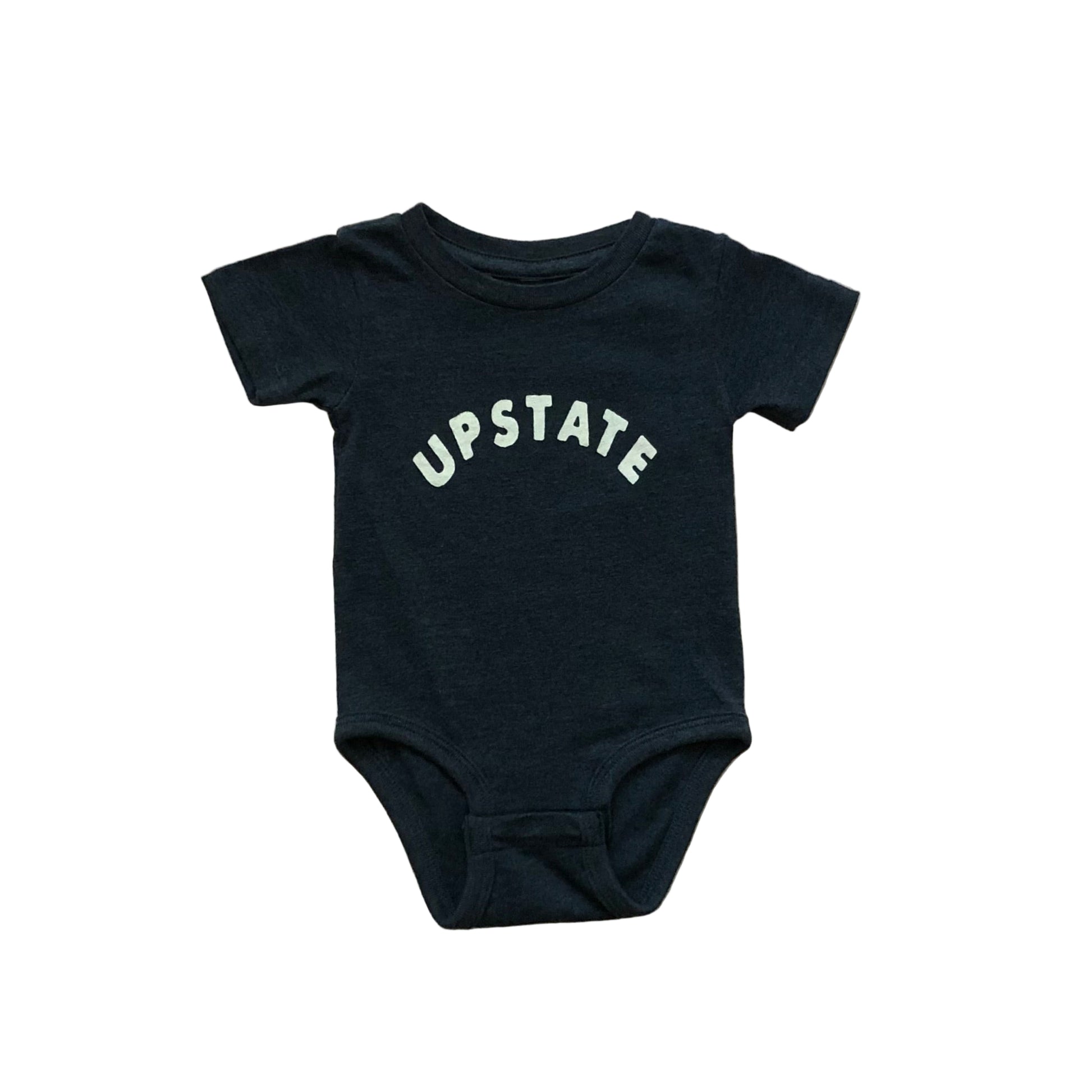 Navy baby onesie with 'UPSTATE' text on a wooden surface