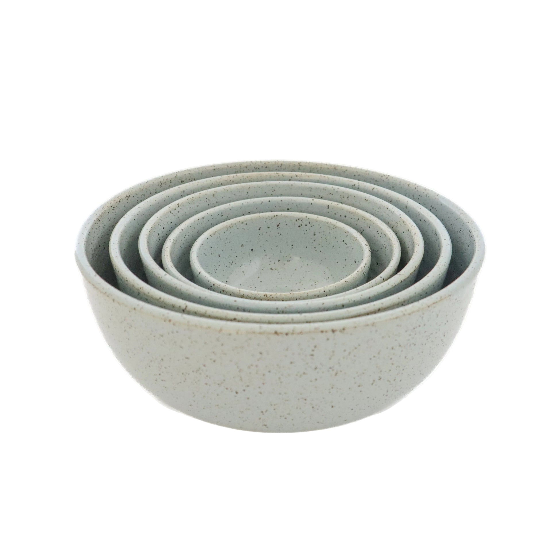 A set of 5 light blue stoneware nesting bowls of various sizes, placed stacked in an ascending order with the smallest at the bottom.